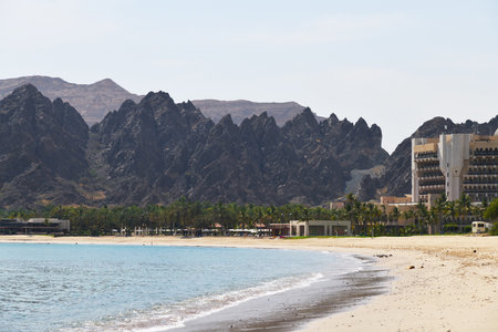 White sands of Al Bustan beach at early morning, most popular beach near city Muscatの写真素材