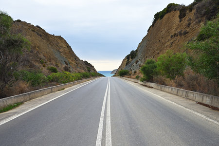 Empty tar road to sea. Messinia, Peloponnese, Greeceの写真素材