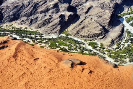Aerial view on the beautiful landscape of the Kuiseb canyon in Namib desert at sunset. Flying on a...