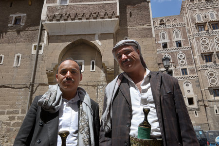 Sanaa, Yemen - March 6, 2010: Two local yemeni men shown at the street in Sanaaのeditorial素材