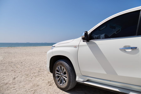 Salalah, Oman - Feb 07, 2026: White off-road car on the Al Haffa is a picturesque stretch of coastline located in Salalahのeditorial素材