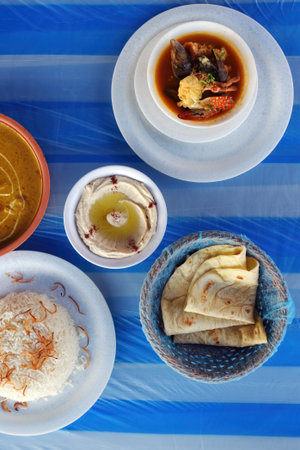 Tomato seafood soup with mussels, shrimps, crabs and octopus. Rice, bread, hummus and shrimps....
