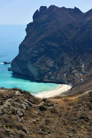 Afoul Beach. This is one of Oman's fascinating beaches hidden among the high mountains. Wadi Afoul is located to the west of Al Mughsail beach in the Governorate of Dhofarの写真素材