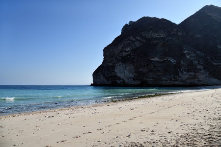 Afoul Beach. This is one of Oman's fascinating beaches hidden among the high mountains. Wadi Afoul is located to the west of Al Mughsail beach in the Governorate of Dhofarの写真素材