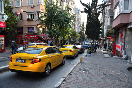 Istanbul, Turkey - December 11, 2023:  Street scene in Istanbul. Taxi on SÄ±raselviler street, Beyoglu district, city of Istanbulのeditorial素材