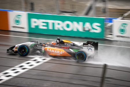 SEPANG - MARCH 29: Nico Hulkenberg of Sahara Force India F1 Team at 2014 Formula 1 Petronas Malaysia Grand Prix Qualifying Session in the rain at Sepang circuit on March 29, 2014 in Sepang, Malaysia.のeditorial素材