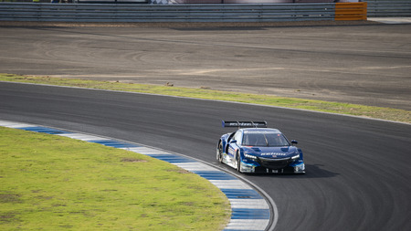BURIRUM, THAILAND - OCTOBER 4 : Toshihiro Kaneishi of KEIHIN REAL RACING in GT500 Qualiflying Category at 2014 AUTOBACS SUPER GT Round7 BURIRAM UNITED SUPER GT RACE on October 4, 2014 in Burirum, Thailand.のeditorial素材