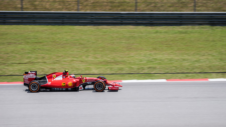 SEPANG - MARCH 27: Kimi R?ikk?nen of Scuderia Ferrari at 2015 Formula 1 Petronas Malaysia Grand Prix Second Practice Session at Sepang circuit on March 27, 2015 in Sepang, Malaysia.のeditorial素材