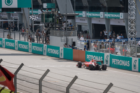 SEPANG  MARCH 29: Sebastian Vettel of Scuderia Ferrari was to Finish line at 2015 Formula 1 Petronas Malaysia Grand Prix Race Day at Sepang circuit on March 29 2015 in Sepang Malaysia.のeditorial素材