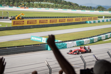 SEPANG  MARCH 29: Sebastian Vettel of Scuderia Ferrari Before finishline at 2015 Formula 1 Petronas Malaysia Grand Prix Race Day at Sepang circuit on March 29 2015 in Sepang Malaysia.のeditorial素材
