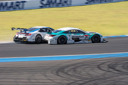 BURIRUM, THAILAND - JUNE 21 : Battle of Super GT Final Race 66 Laps at 2015 AUTOBACS SUPER GT Round 3 BURIRAM SUPER GT RACE on June 21, 2015 in Burirum, Thailand.のeditorial素材