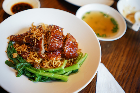 Dry noodles with roasted duck and vegetableの写真素材