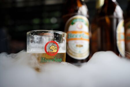 Vangviang, Laos - March, 09, 2018 : Beerlao on smokeのeditorial素材