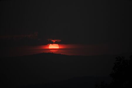 Silhouette mountain the big sunset or sunriseの写真素材