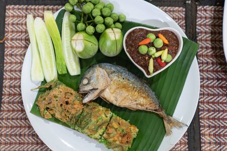 Spicy Shrimp Paste Dip with vegetables fried egg and fried mackerel side dishの写真素材