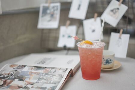 Iced Peach and rosemary lemonade, cocktail on a table backgroundの写真素材
