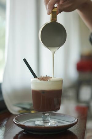 Iced Chocolate, Iced Cocoa with milk froth and chocolate chip topping, drinkの写真素材