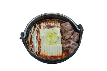 Kimchi Jjigae or Kimchi Soup with Tofu and Egg, Korean Kimchi Stew - Korean Food Traditional Style served in hot pot isolated on white backgroundの写真素材
