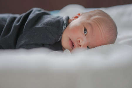 Close Up newborn baby on bedの写真素材