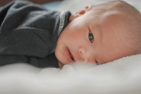 Close Up newborn baby on bedの写真素材