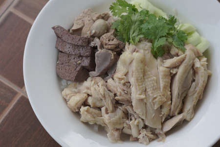 Top view chicken rice with vegetable on tile textureの写真素材