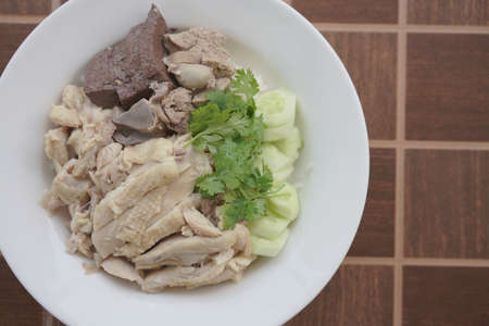 Top view chicken rice with vegetable on tile textureの写真素材