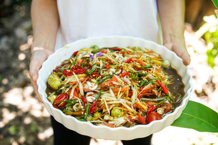 Super hot and spicy Papaya Salad with Big Tray top viewの写真素材