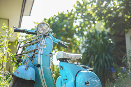 Nakhon Ratchasima, Thailand - June 09, 2020  : Portrait shot of Vespa Motobike close up light on greensward ,Nakhon Ratchasima Thailand.のeditorial素材