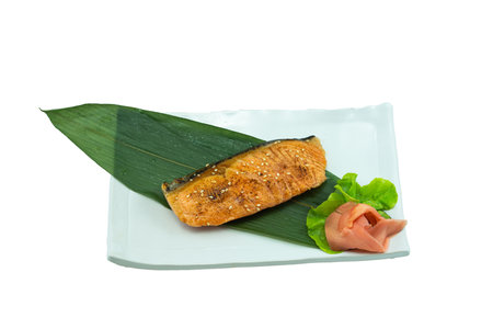 Grilled salmon fillets steaks with salt pepper and herb on grill. Isolated on white background.の写真素材