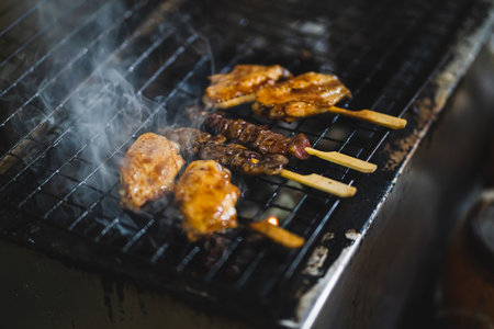 Japanese barbecue on bamboo skewers Japan food izakaya style on charcoal stove, Selective Focus.の写真素材