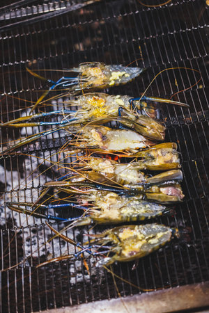 Grilled shrimps on the flaming grill.の写真素材