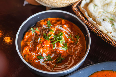 Chicken tikka masala spicy curry meat food Butter chicken on dark background close-up.の写真素材