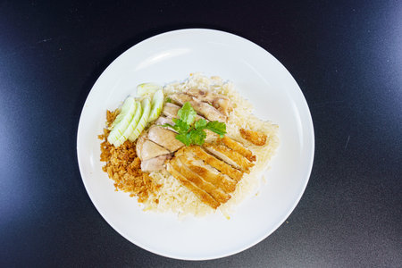 Chicken rice with fried chicken or rice steamed chicken soup with fried chicken - Asian food style.の写真素材