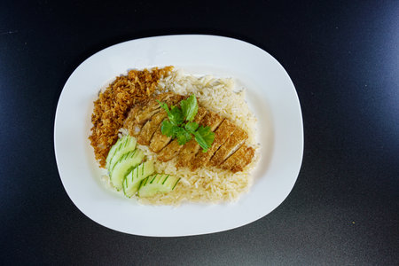 Fried chicken rice with fried chicken or rice steamed chicken soup with fried chicken - Asian food style.の写真素材