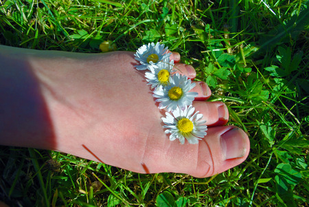 a foot with four flowers onの写真素材