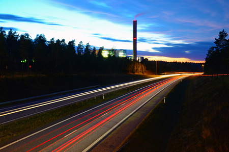 Chimney next to the highwayの写真素材