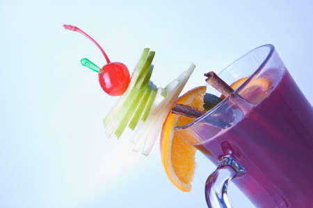 cocktail with apple orange cherry and cinnamon in a beautiful glass Fougeresの写真素材