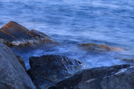 waves on the rocksの写真素材