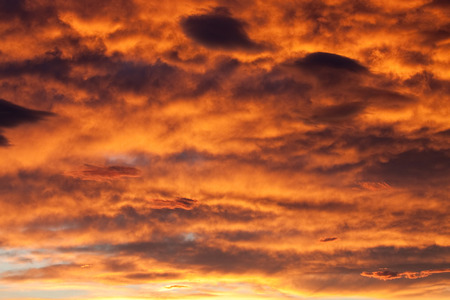 fiery clouds at sunsetの写真素材