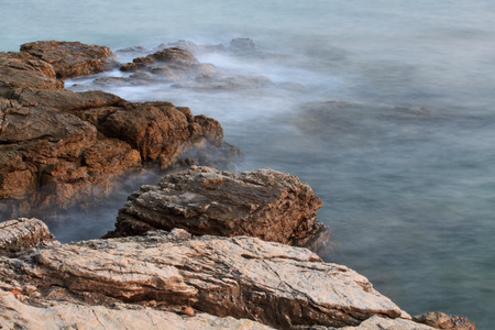 waves on the rocksの写真素材