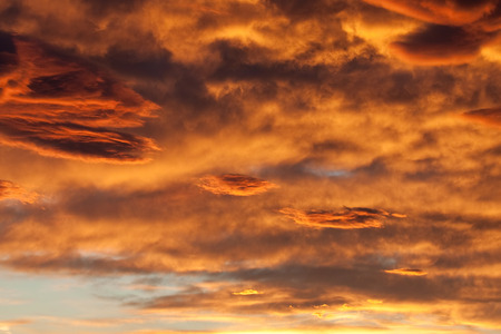 fiery clouds at sunsetの写真素材