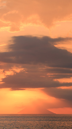 sunset on the island of Stromboli from Capo Vaticanoの写真素材