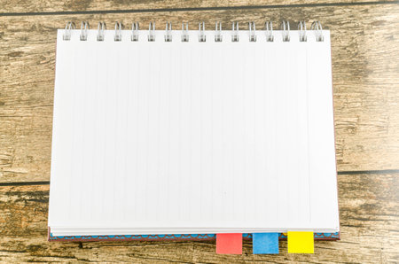 Notebook on wooden tableの写真素材