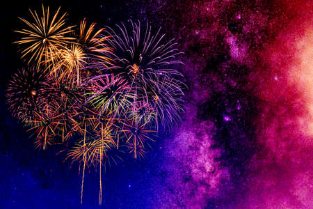 Fireworks with blur milky way backgroundの写真素材
