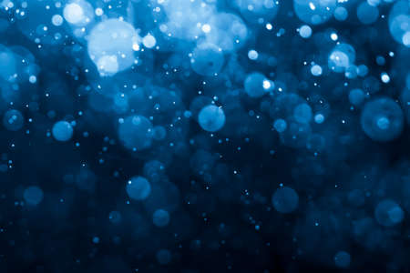 Abstract Blue bokeh defocus glitter blur background.