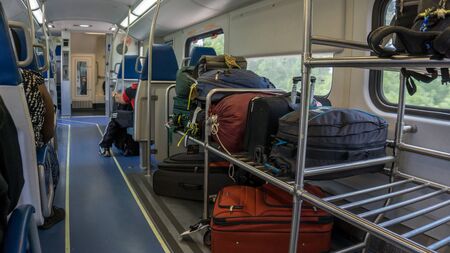 FORT LAUDERDALE, MIAMI. USA - AUGUST 30, 2018. Luggage wagon from the Tri Rail train North Bound in a busy dayのeditorial素材