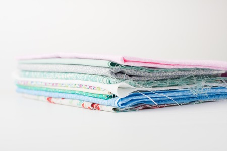 isolated close up of a pile of colorful fabric