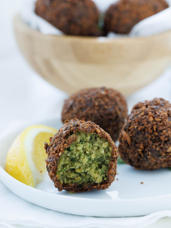 Falafel on white plate served with lemon