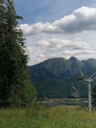 mountain panorama with ski lift on the background of blue skyの写真素材