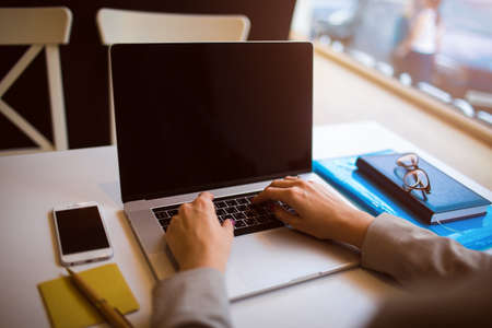 Business owner working on laptop compute with empty copy space screen background for advertising...
